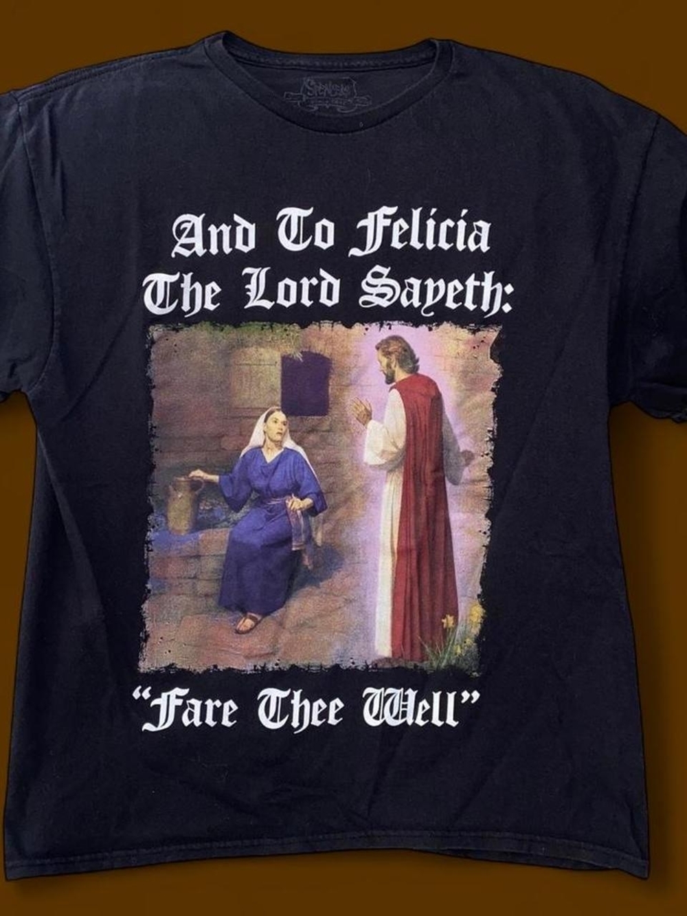 Spencer's Black T‑Shirt with White Text and Multicolor Religious Graphic